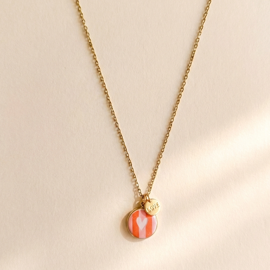 Necklace with a round pendant featuring a striped design on a beige background