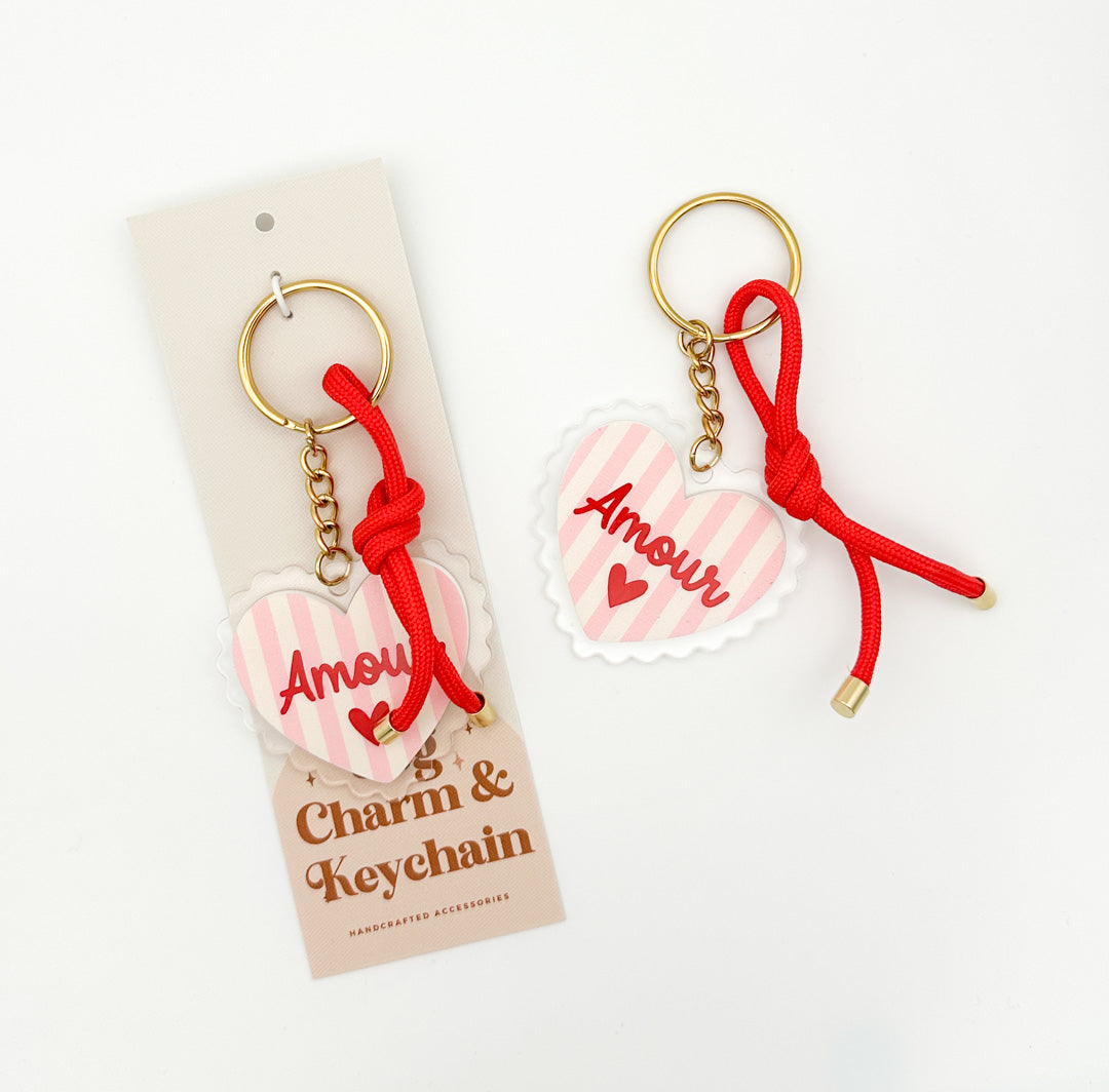 Amour heart keychain and bag charm by Miminoo Jewelry shown with branded packaging, pink heart charm and red cord detail